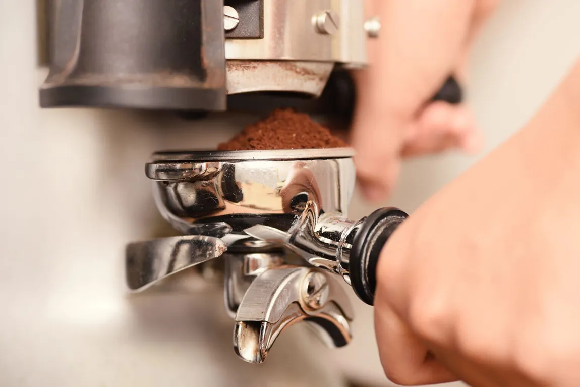 close up hand making coffee